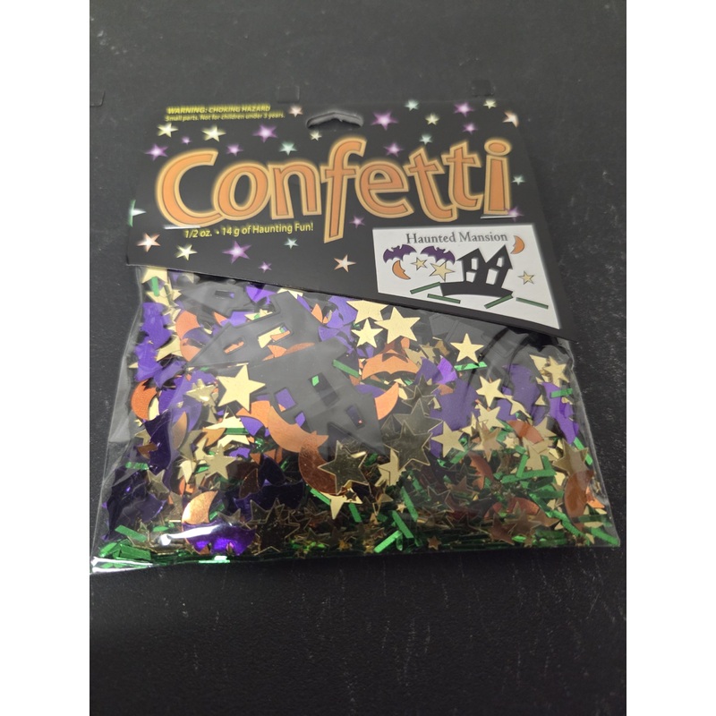 .5 Ounce Haunted Mansion Confetti with Purple Bats, Orange Moons, Gold Stars, Black Mansion and Green Grass.